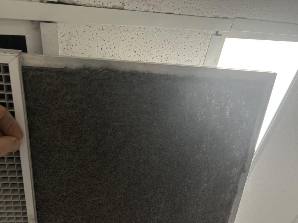 Dust loading on an HVAC filter during a commercial hygiene assessment